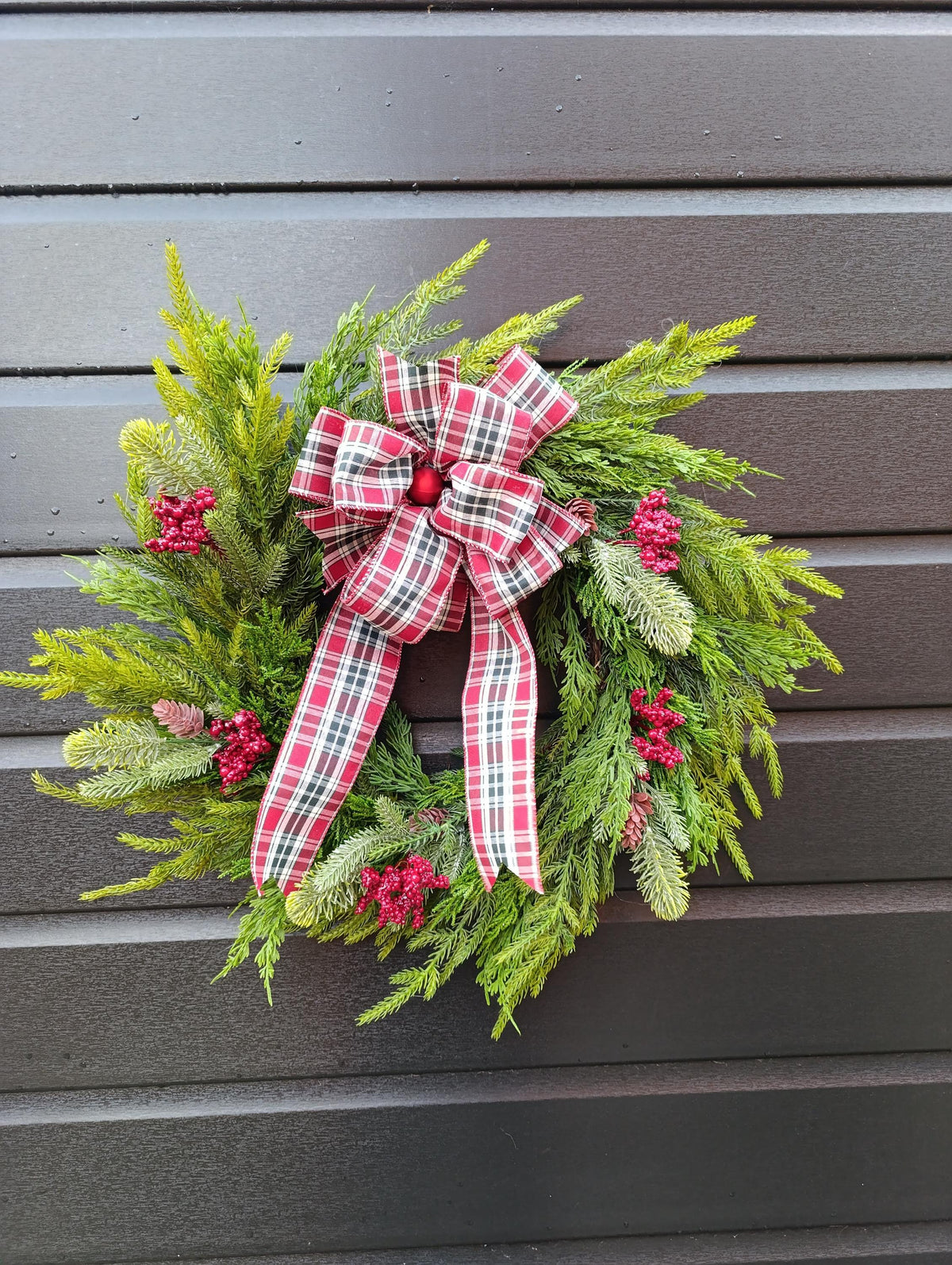 Norfolk Pine and Cedar Realistic Greenery Wreath with Red Berries and Feature Plaid Tartan Bow