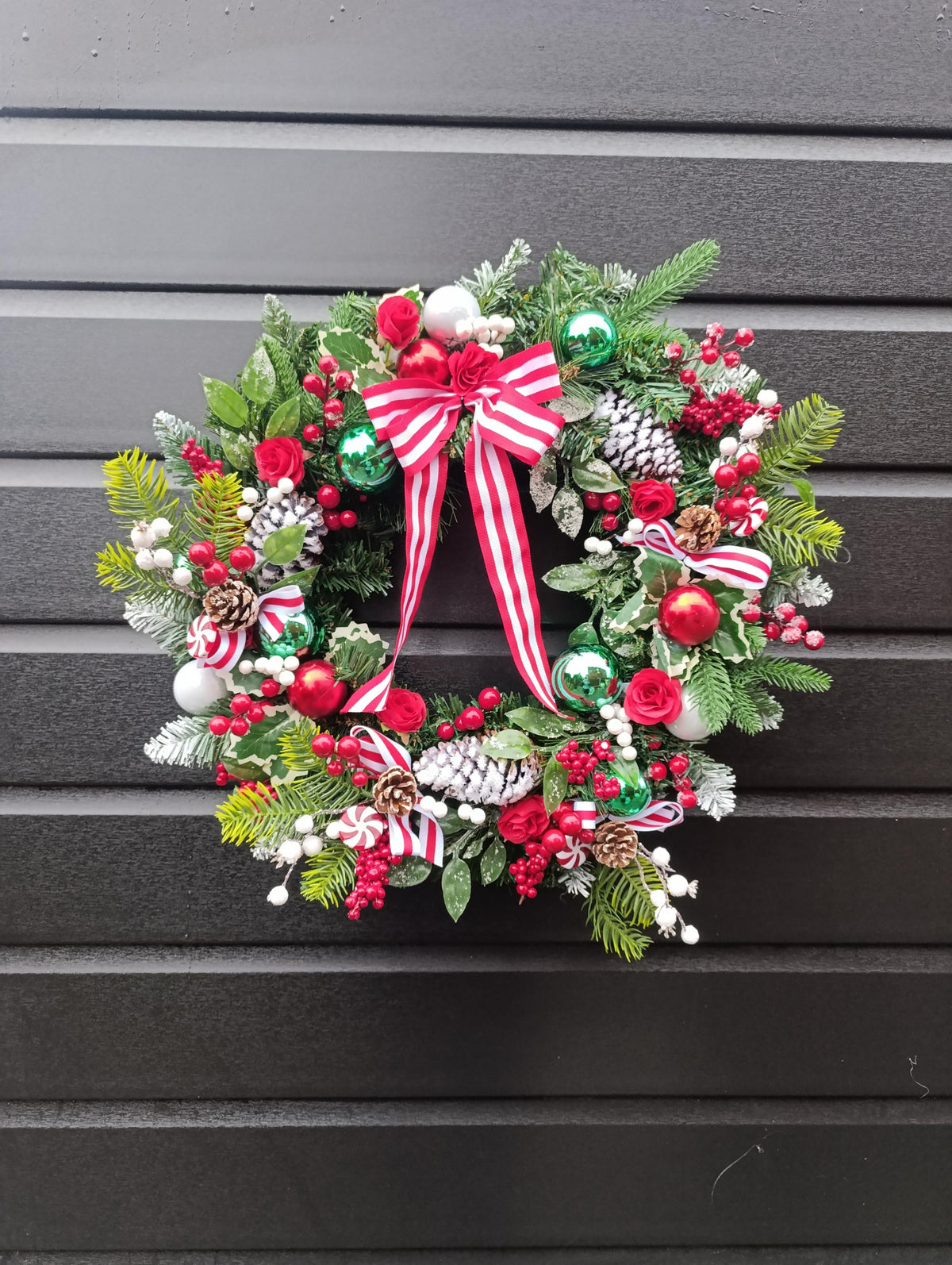 Traditional 60 cm Christmas Wreath with Red Roses, Flocked Pine Cones and Candy Cane Accents