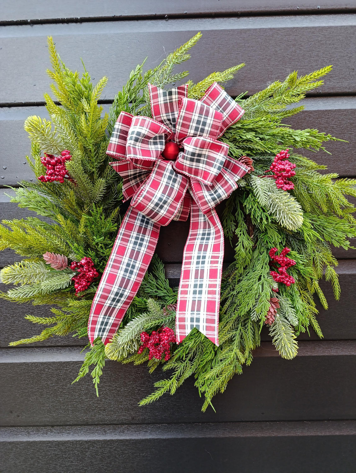 Norfolk Pine and Cedar Realistic Greenery Wreath with Red Berries and Feature Plaid Tartan Bow