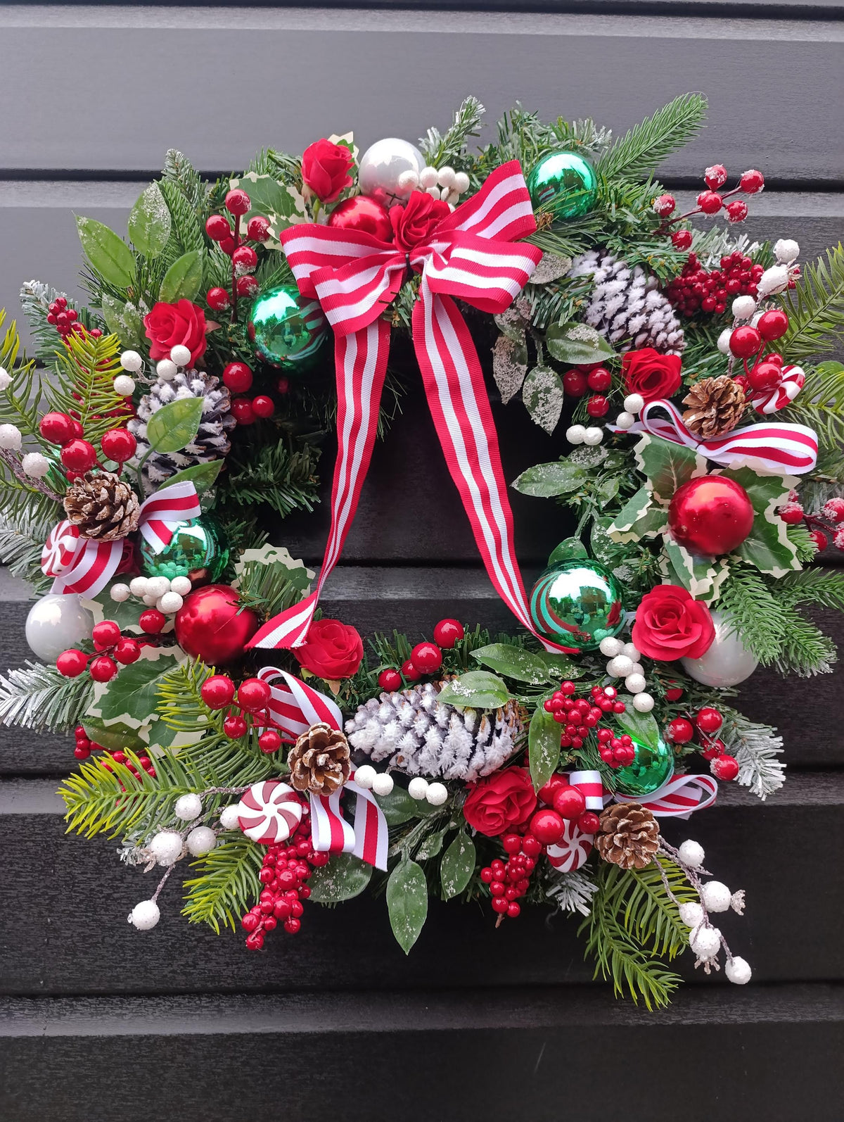 Traditional 60 cm Christmas Wreath with Red Roses, Flocked Pine Cones and Candy Cane Accents